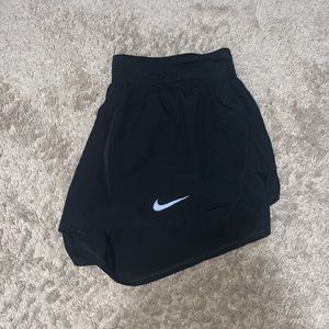 - Size M black Nike shorts